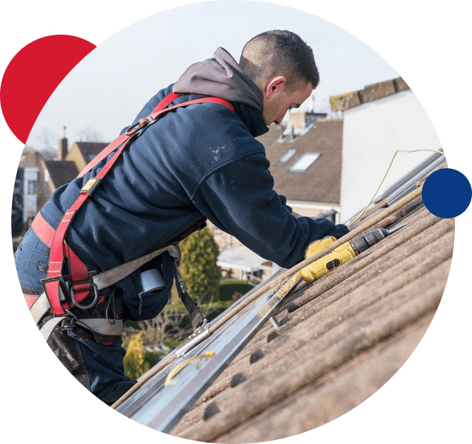 A man working on the roof of his home.