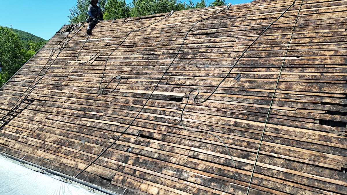 Damaged roof decking found during full tear-off roof replacement in Jermyn PA by Zenobi Roofing Inc.