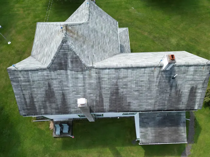 Black algae streaks on asphalt roof shingles in Northeast Pennsylvania
