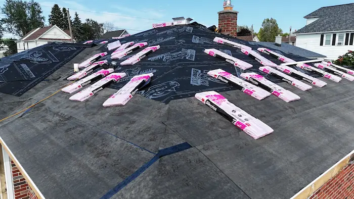 Roof replacement in progress showing underlayment and asphalt shingles in Lackawanna County Pennsylvania