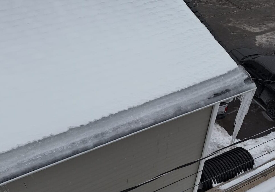 Snow covered residential roof during winter in Northeastern Pennsylvania showing conditions roofs face in Lackawanna County